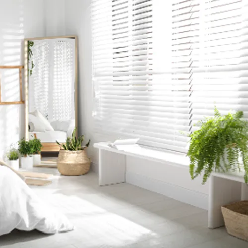 White window blinds in bedroom
